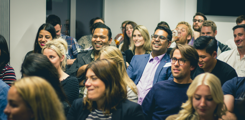 Dentists sit together at an event.