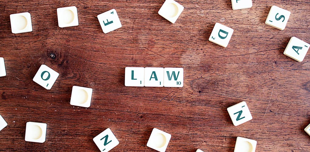 square tiles spelling "law" depicting 2023 healthcare law updates