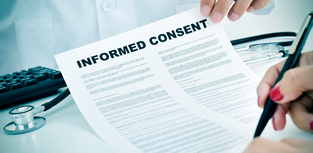 A piece of paper reading "Informed Consent"