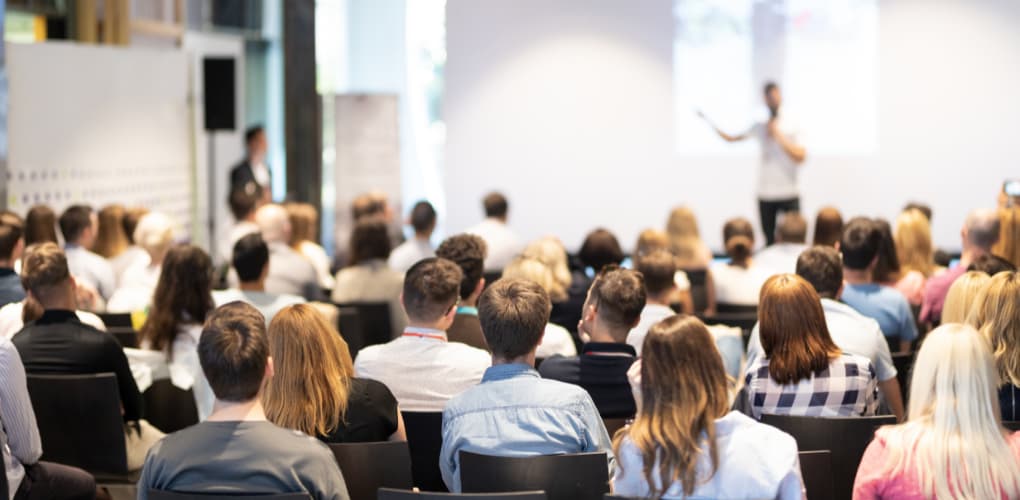 A group of dentists sit at a January 2023 event for dentists in New York.