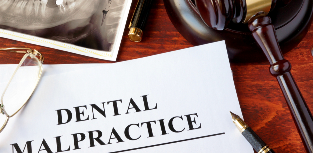 Blog on high-severity dental liability with image of a dental malpractice document