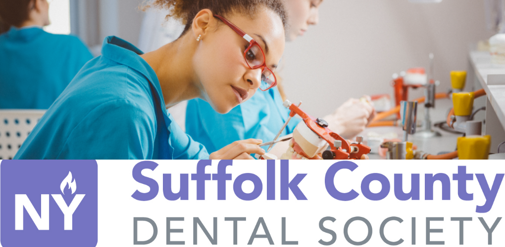 A woman studies teeth overlayed with the Suffolk County Dental Society symbol.
